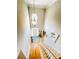 The foyer is very tall and has a bright light fixture to illuminate the space at 5771 Vinings Retreat Sw Way, Mableton, GA 30126