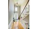 Elegant foyer with hardwood floors, a staircase, and a pendant light fixture at 5771 Vinings Retreat Sw Way, Mableton, GA 30126