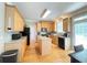 Well-lit kitchen with an island, stainless steel appliances, and lots of counter space at 5771 Vinings Retreat Sw Way, Mableton, GA 30126