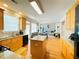 Bright, open kitchen with an island and view into the open floor plan at 5771 Vinings Retreat Sw Way, Mableton, GA 30126