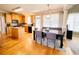 Charming kitchen with center island, dining area and wood flooring at 5771 Vinings Retreat Sw Way, Mableton, GA 30126