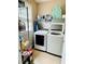 Laundry room featuring newer washer and dryer, shelving and a window at 5771 Vinings Retreat Sw Way, Mableton, GA 30126