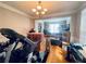 Living room with hardwood floors, chandelier, and moving boxes at 5771 Vinings Retreat Sw Way, Mableton, GA 30126