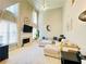 Spacious living room features a fireplace, tall windows, and modern decor at 5771 Vinings Retreat Sw Way, Mableton, GA 30126