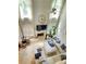 Bright and airy living room featuring soaring ceilings, a fireplace, and large windows at 5771 Vinings Retreat Sw Way, Mableton, GA 30126