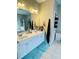This double sink vanity has good lighting, plenty of counter space and cabinets, and stylish decor at 5771 Vinings Retreat Sw Way, Mableton, GA 30126