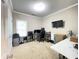 Home office featuring neutral walls, carpet flooring, and a view of the outdoor scenery at 5771 Vinings Retreat Sw Way, Mableton, GA 30126