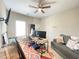 Bright office space with a desk, monitors, a comfortable sofa, and a large window at 5771 Vinings Retreat Sw Way, Mableton, GA 30126