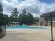 Community pool with ample seating and a nearby clubhouse for gatherings at 5771 Vinings Retreat Sw Way, Mableton, GA 30126