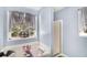Cozy bathroom featuring a tub, a shower, and a window with natural light at 136 Fairlane Dr, Covington, GA 30016