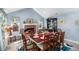 Elegant dining room with a fireplace, complemented by stylish furniture and natural light at 136 Fairlane Dr, Covington, GA 30016