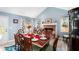 Elegant dining room with a fireplace, complemented by stylish furniture and decor at 136 Fairlane Dr, Covington, GA 30016