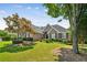 Well-maintained brick home with a lush green lawn, complemented by mature trees for added privacy and shade at 1506 Threepine Place Pl, Lilburn, GA 30047
