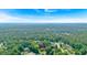 Aerial view of a home surrounded by lush greenery, highlighted by a location marker at 5148 Coolamber Dr, Powder Springs, GA 30127