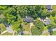 Aerial view of a home with a lush lawn and mature trees, nestled in a neighborhood at 5148 Coolamber Dr, Powder Springs, GA 30127