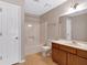 Bathroom featuring a shower-tub combo, toilet, and a vanity with ample countertop space at 5148 Coolamber Dr, Powder Springs, GA 30127