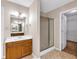 Bathroom featuring tile floors, a shower, and a walk in closet at 5148 Coolamber Dr, Powder Springs, GA 30127