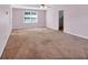 Spacious bedroom with window and entrance to another room at 5148 Coolamber Dr, Powder Springs, GA 30127
