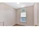 Small bedroom showcasing a window with blinds and a neutral color palette at 5148 Coolamber Dr, Powder Springs, GA 30127