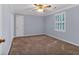 Bedroom with a side closet and a window that allows natural light to brighten up the room at 5148 Coolamber Dr, Powder Springs, GA 30127