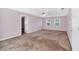 Spacious bedroom featuring a ceiling fan and two windows providing natural light at 5148 Coolamber Dr, Powder Springs, GA 30127