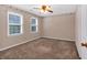 Bedroom with light-colored walls, decorative border, and windows that provide ample natural light at 5148 Coolamber Dr, Powder Springs, GA 30127