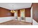 Formal dining room featuring chandelier and classic wallpaper at 5148 Coolamber Dr, Powder Springs, GA 30127