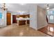 Open kitchen design concept features wood cabinets and tile floors at 5148 Coolamber Dr, Powder Springs, GA 30127
