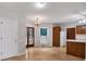 Cozy kitchen features tile floors, wood cabinets and a breakfast bar at 5148 Coolamber Dr, Powder Springs, GA 30127