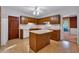 Traditional eat-in kitchen with wood cabinets, white countertops, and a center island at 5148 Coolamber Dr, Powder Springs, GA 30127