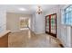 Bright kitchen and breakfast area features a chandelier and french doors at 5148 Coolamber Dr, Powder Springs, GA 30127