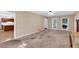 Bright living room with access to kitchen at 5148 Coolamber Dr, Powder Springs, GA 30127