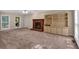 Spacious living room with brick fireplace and large windows at 5148 Coolamber Dr, Powder Springs, GA 30127