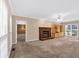 Cozy living room with a brick fireplace and built-in shelving at 5148 Coolamber Dr, Powder Springs, GA 30127