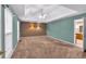 Large bedroom with vaulted ceilings, carpet, and decorative wall accents at 5148 Coolamber Dr, Powder Springs, GA 30127