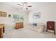 Bedroom with ceiling fan, plantation shutters, neutral carpet, and neutral color palette at 6042 Brookhaven Cir # 3202, Johns Creek, GA 30097