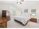 Bright bedroom with vaulted ceiling, ceiling fan, plantation shutters, and neutral color palette at 6042 Brookhaven Cir # 3202, Johns Creek, GA 30097