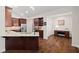 Kitchen featuring dark wood cabinets, modern stainless steel appliances, and granite countertops at 6042 Brookhaven Cir # 3202, Johns Creek, GA 30097