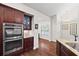 Kitchen featuring stainless steel double oven and granite counters at 6042 Brookhaven Cir # 3202, Johns Creek, GA 30097