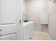 Laundry room with washer, dryer, and white cabinetry at 6042 Brookhaven Cir # 3202, Johns Creek, GA 30097