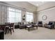 Inviting sitting area with a comfortable sofa, armchairs, neutral tones and natural light at 6042 Brookhaven Cir # 3202, Johns Creek, GA 30097