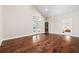 Hardwood floors lead to an elegant room with high ceilings and a doorway at 6042 Brookhaven Cir # 3202, Johns Creek, GA 30097