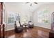 Bright living room featuring hardwood floors, many windows, and natural light at 6042 Brookhaven Cir # 3202, Johns Creek, GA 30097