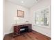 Cozy home office featuring hardwood floors and natural light, perfect for working from home at 6042 Brookhaven Cir # 3202, Johns Creek, GA 30097