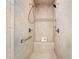 Tiled shower with built-in bench, mosaic accents, hand-held sprayer, and shower head at 6042 Brookhaven Cir # 3202, Johns Creek, GA 30097