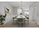 Refined dining room featuring an elegant chandelier, neutral wall colors, and modern furniture at 68 La Rue Nw Pl, Atlanta, GA 30327