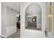 Inviting entryway featuring neutral tones and an arched opening to the dining room with chandelier at 68 La Rue Nw Pl, Atlanta, GA 30327
