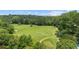 Aerial view of a lush golf course with mature trees at 68 La Rue Nw Pl, Atlanta, GA 30327