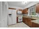A kitchen featuring granite countertops, updated appliances, and ample cabinet space at 68 La Rue Nw Pl, Atlanta, GA 30327
