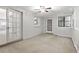 Neutral living room with lots of light, ceiling fan, and french door access at 68 La Rue Nw Pl, Atlanta, GA 30327